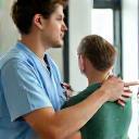 Physiotherapist assisting a client