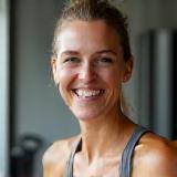 Emma, Head Trainer, smiling in the gym